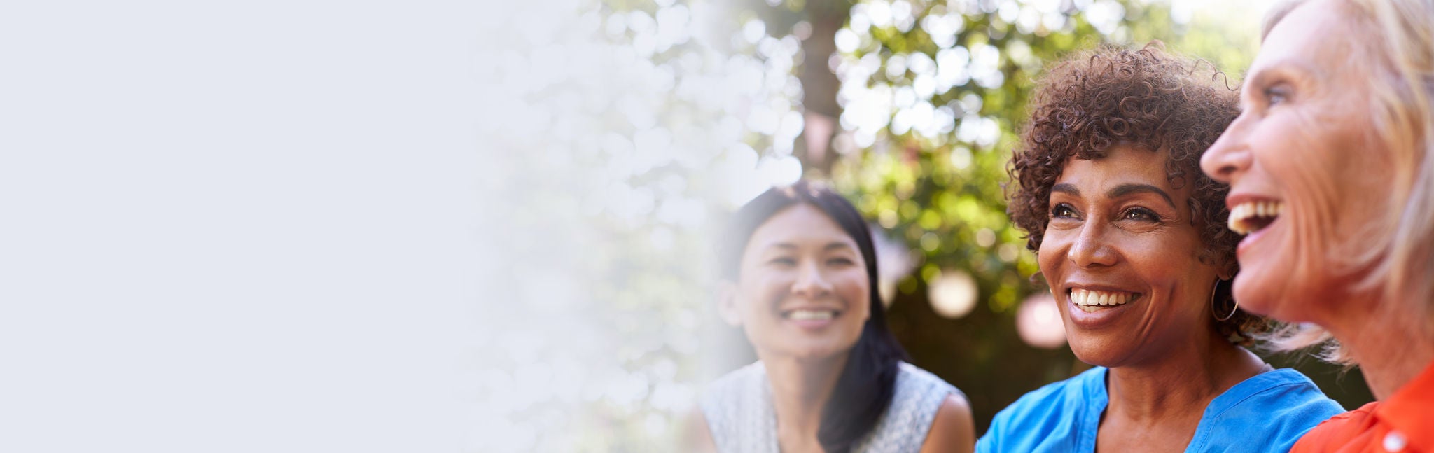 Couple walking on beach while holding hands of each other.